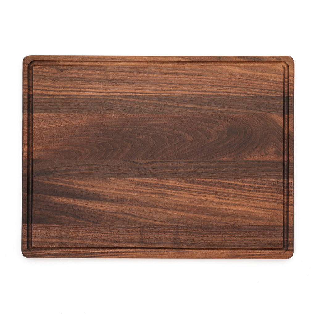 Extra large walnut cutting board with a juice groove, 24 x 18 in, straight overhead view on white