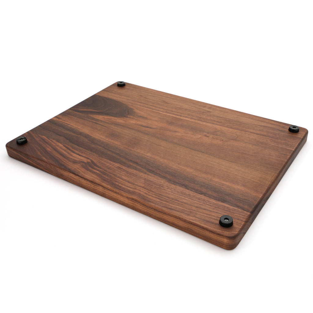 Extra large thick walnut cutting board, 24 x 18 in, angled view of the underside with pale sapwood edge