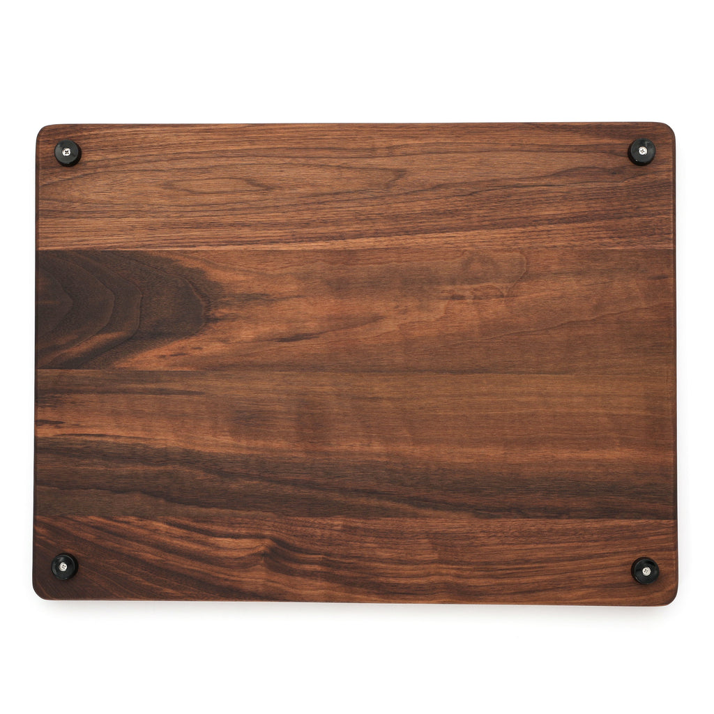 Extra large thick walnut cutting board, 24 x 18 in, overhead view of the underside with mixed grain