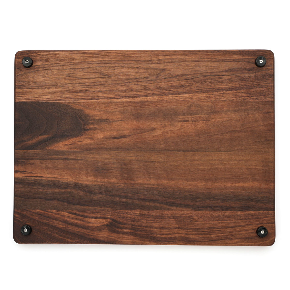 Extra large thick walnut cutting board, 24 x 18 in, overhead view of the underside with mixed grain