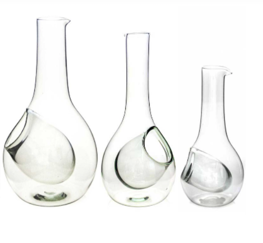 Three recycled glass wine decanters with built-in ice pockets, shown in small, medium and large sizes
