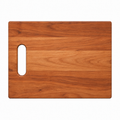Single handle cutting board in cherry, 12 x 9 in, with a cut-in handle on the left, overhead view on white