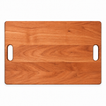 Classic cherry cutting board, 18 x 12 in, with cutout handles and no groove, overhead view on white