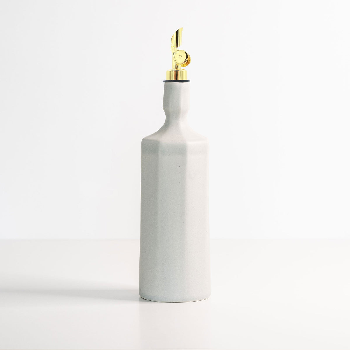 Porcelain Olive Oil Dispenser in a closer view of the silhouette against a white ground