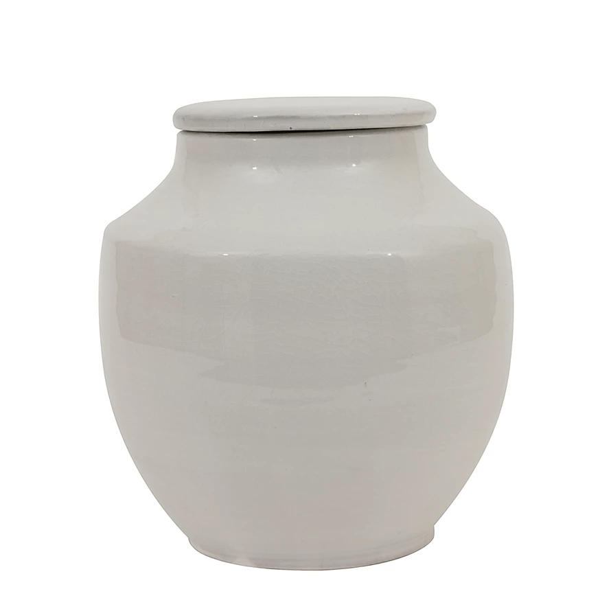 Short rounded white glazed terracotta jar shown on its own against a white background