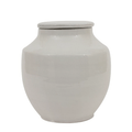 Short rounded white glazed terracotta jar shown on its own against a white background