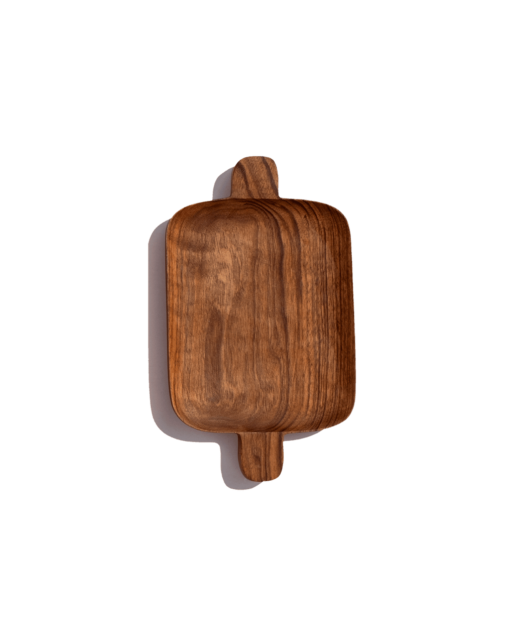 Small walnut serving tray with handles at both ends, shown from above against a solid green ground