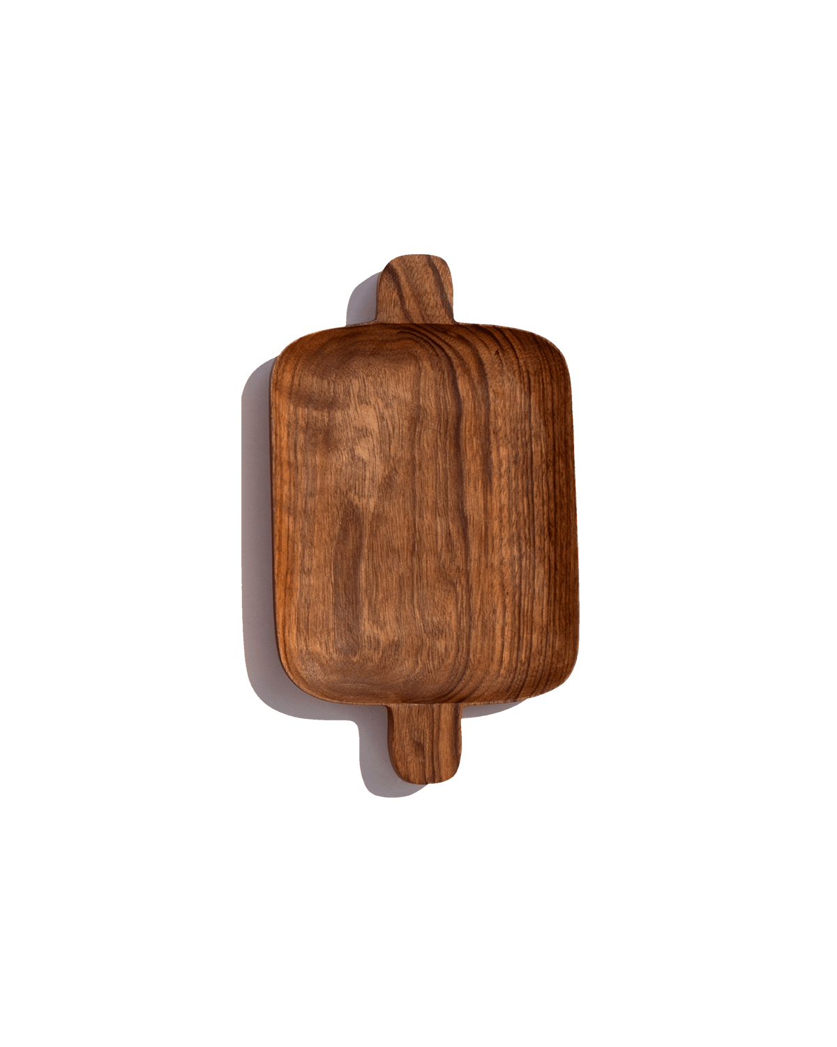 Small walnut serving tray with handles at both ends, shown from above against a solid green ground