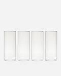 Tall Handblown Drinking Glassware photographed on a bone white surface in soft natural light