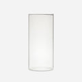 Tall clear handblown glass cylinder vase with straight sides, shown empty on a pale gray background