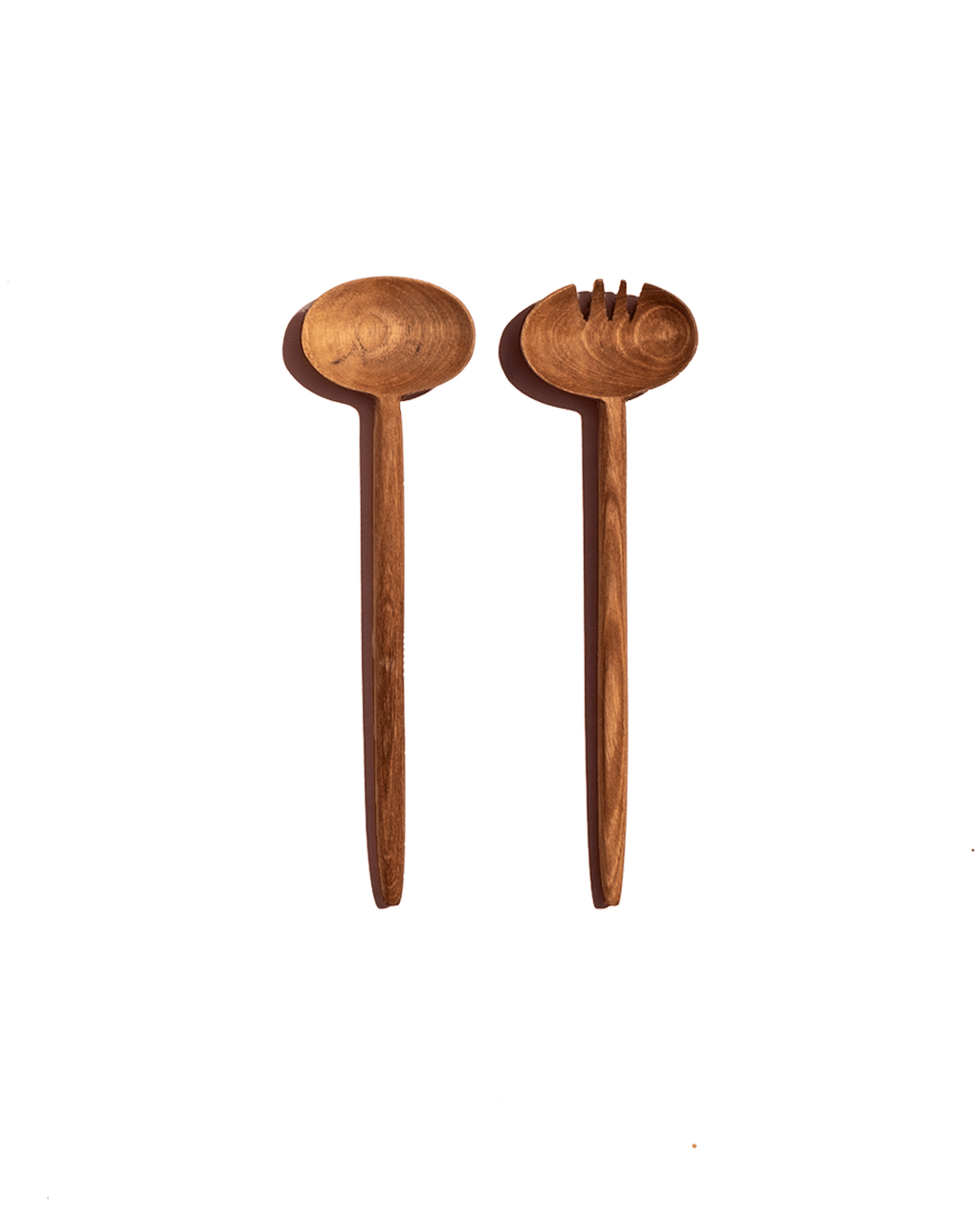 Single pair of carved walnut salad servers with oval heads shown on a deep green background