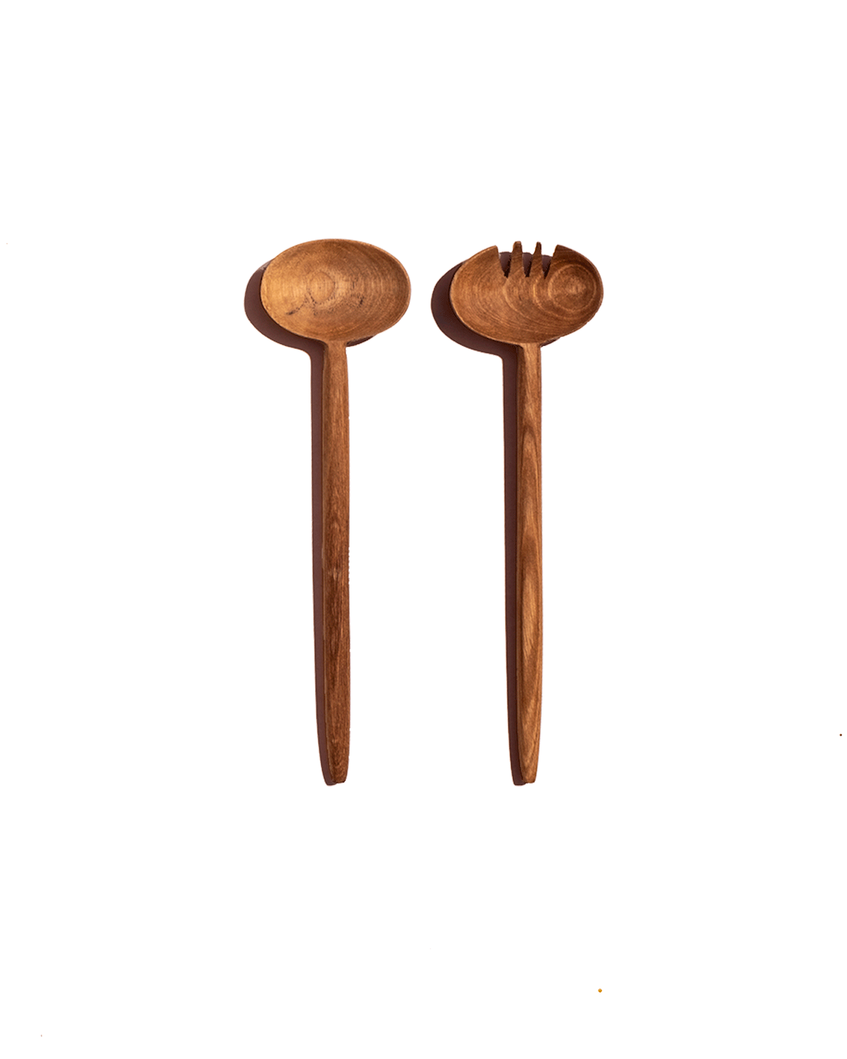 Single pair of carved walnut salad servers with oval heads shown on a deep green background