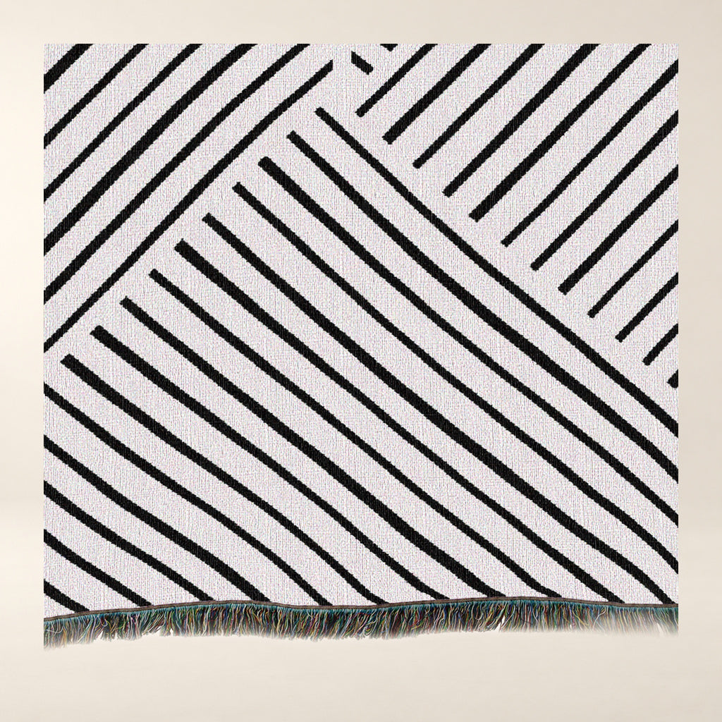 Diagonal Lines Woven Cotton Throw, Black and Ivory tighter close-up of the photographed surface.