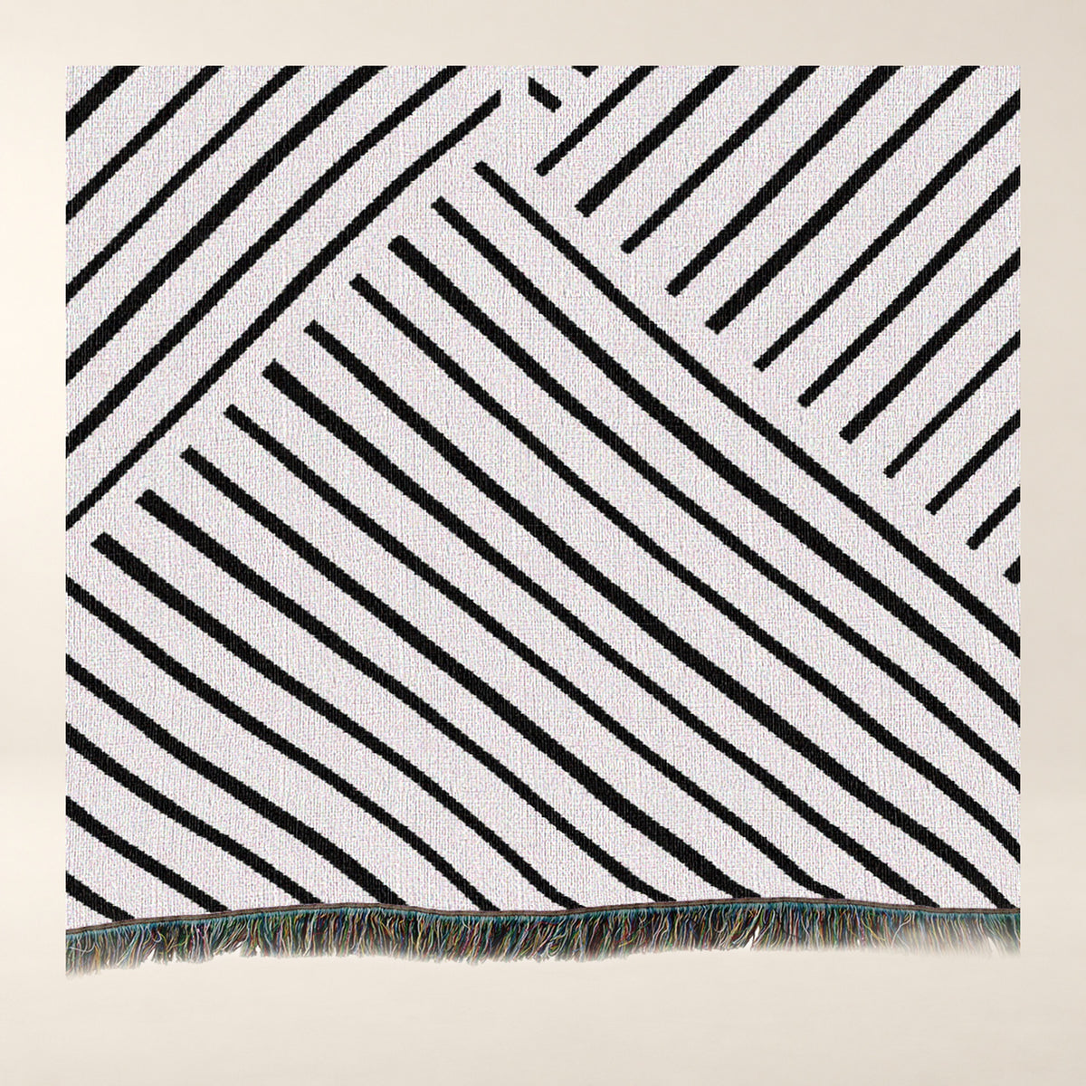 Diagonal Lines Woven Cotton Throw, Black and Ivory tighter close-up of the photographed surface.