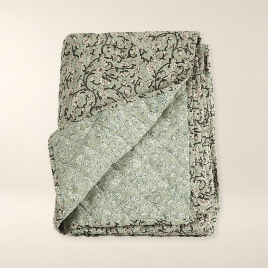 Keya Linen Block Print Quilted Coverlet on a warm bone background.