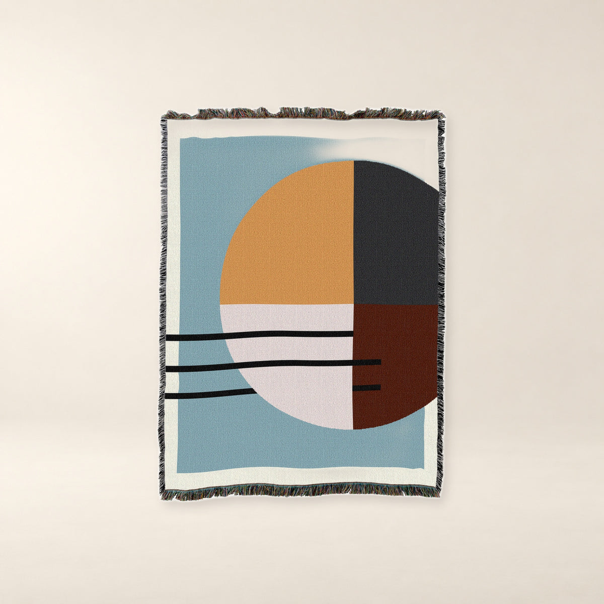 Quartered Sun Abstract Woven Cotton Throw on a warm bone background.