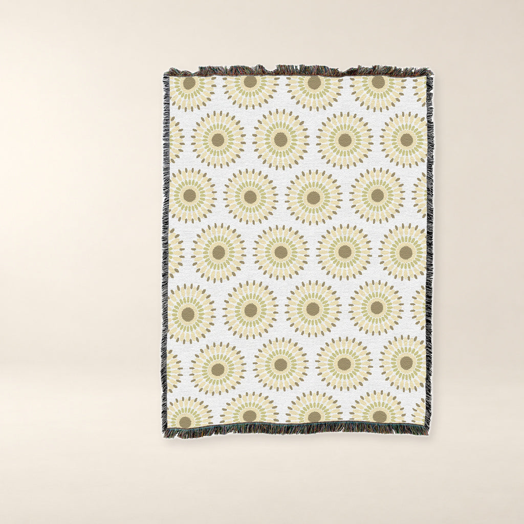 Sand Sunburst Woven Cotton Throw on a warm bone background.