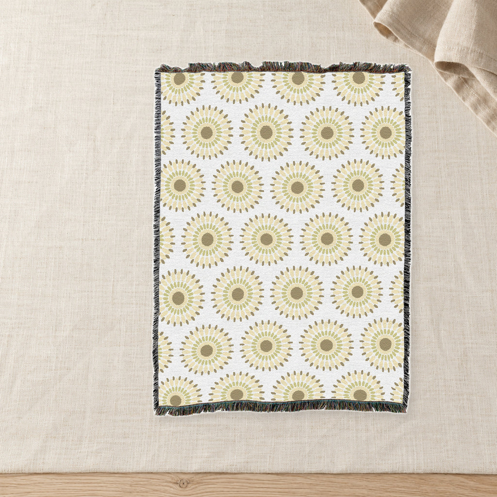 Sand Sunburst Woven Cotton Throw on raw linen with a folded napkin.